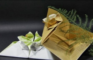 一枚精致的开着一朵美丽小花的信封，漂亮的六花瓣信封折纸方法